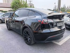 A 2021 black Tesla Model Y with low mileage (330,00 miles), in excellent condition, ready for export overseas at any time.