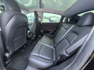 A 2021 black Tesla Model Y with low mileage (330,00 miles), in excellent condition, ready for export overseas at any time.