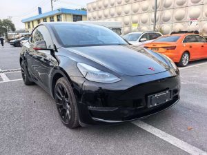 A 2021 black Tesla Model Y with low mileage (330,00 miles), in excellent condition, ready for export overseas at any time.