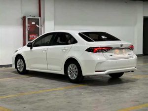 A 2021 White Toyota Corolla 1.5L Pioneer with low mileage ( 42,620 miles), in excellent condition, ready for export overseas at any time.