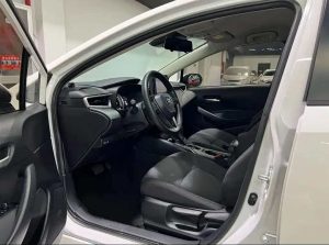 A 2021 White Toyota Corolla 1.5L Pioneer with low mileage ( 42,620 miles), in excellent condition, ready for export overseas at any time.