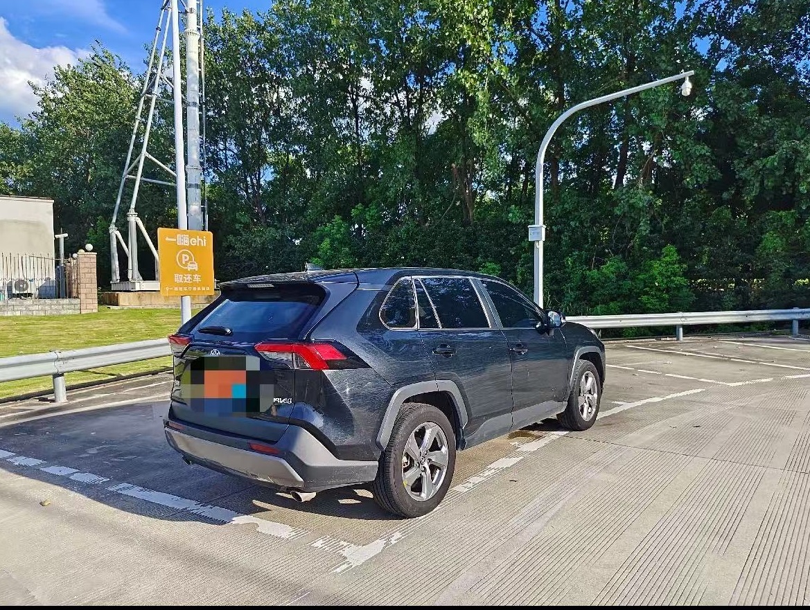 Spacious rear and tailgate of a 2023 Toyota RAV4, ideal for family or business use in Nigeria.